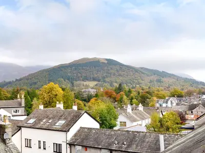 a town with houses and a mountain in the background at Bianca Rose in Keswick