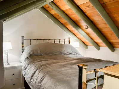 a bedroom with a bed in a attic at Lucy's Lodge - Uk1260 in Threlkeld