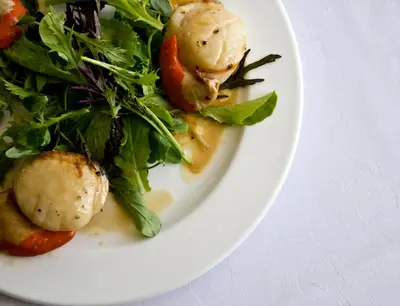 a plate of food with vegetables on a table at Cavens Country House, DINNER INCLUSIVE! in Kirkbean
