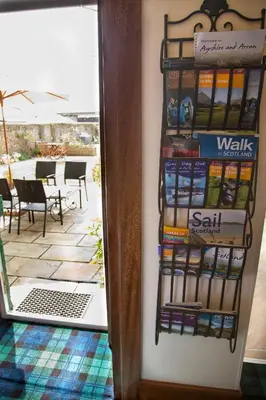 a display of books on a wall next to a door at Beaches in Ayr
