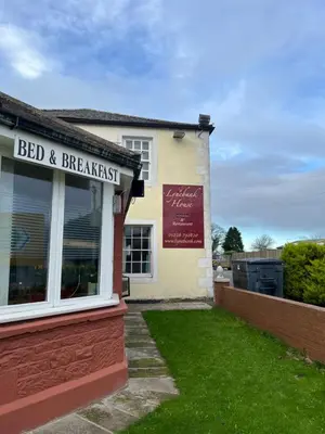 a building with a sign for a bed and breakfast at Lynebank House Hotel, Bed & Breakfast in Carlisle