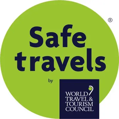 a sign with the words safe travels on a green circle at Little Dunbar Cottage in Kirkbean