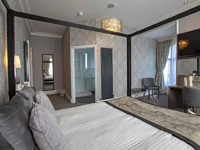 a bedroom with a large bed in a room at Sure Hotel by Best Western Lockerbie in Lockerbie