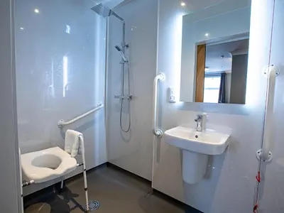 a bathroom with a toilet and a sink and a shower at Sure Hotel by Best Western Lockerbie in Lockerbie