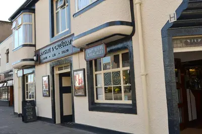a building on a street with signs on it at The Ayrshire and Galloway in Ayr