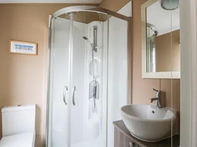 a bathroom with a shower and a sink at Cheri in Mainsriddle