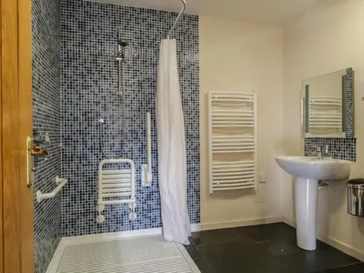a bathroom with a shower and a sink at Buttermere in Cockermouth