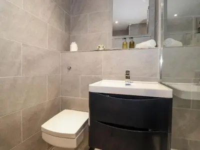a bathroom with a toilet and a sink at The Hayloft in Keswick