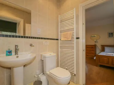 a bathroom with a toilet and a sink at The Old Vicarage in Thirlmere