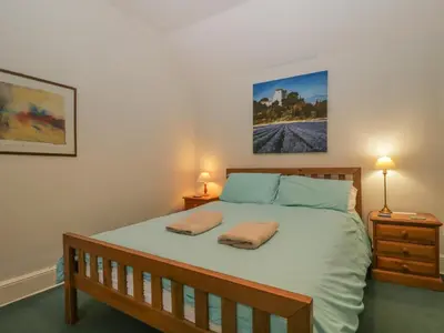 a bedroom with a bed with two pillows on it at The Old Vicarage in Thirlmere