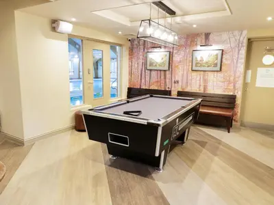 a room with a ping pong table in it at Savita Cottage in Girvan