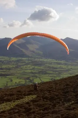 a person flying a parachute on a hill at Lyndhurst in Keswick