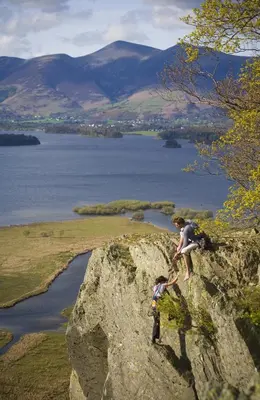 two people on a rock overlooking a body of water at Lyndhurst in Keswick