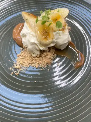 a blue plate with a dessert on top at The Garret Hotel in Kirkcudbright