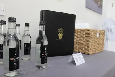a group of bottles of wine sitting on a table at The Town House in Douglas