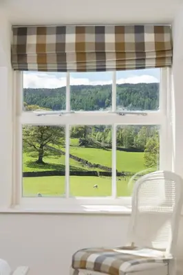 a window with a view of a golf course at The King's Head in Thirlmere