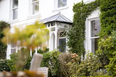 a white house with a gazebo at Dale Head Hall Lakeside Hotel in Keswick