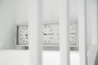 two clocks sitting on top of a window at The Annex in Carlisle