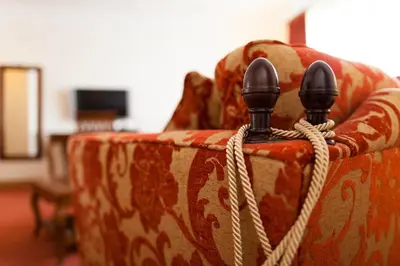 a pair of shoes tied to a couch at Woodland House Hotel in Dumfries