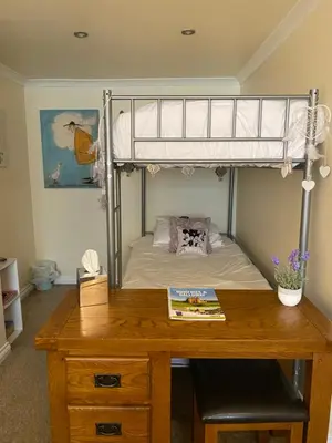 a bedroom with a bunk bed and a wooden desk at Black Bull Inn, Moffat in Moffat