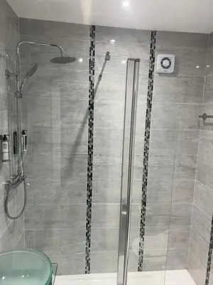 a bathroom with a shower with a glass door at Ellan Vannin Hotel in Douglas