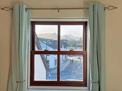 a window with a view of a street at Hindscarth in Keswick