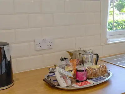 a tray of food sitting on a kitchen counter at Rotherwood in Portinscale