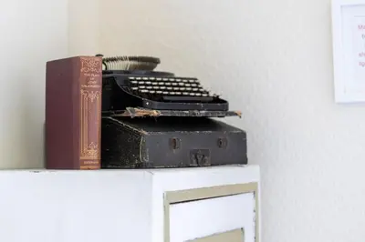 a book and a typewriter on top of a table at Craigmount in Wigtown