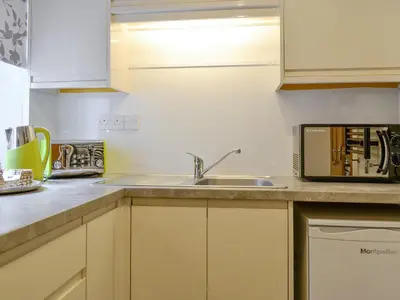 a kitchen with a sink and a microwave at Shepherds Bield - Uk1349 in Threlkeld
