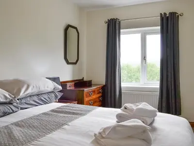 a bedroom with a bed and a window at Shepherds Bield - Uk1349 in Threlkeld
