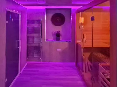 a purple room with a walk in closet and a door at The Golden Crown in Tarbolton