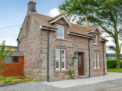 a small brick house with at Rose Cottage in Cleator