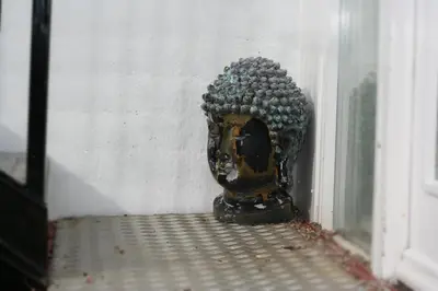 a vase sitting in the corner of a window at The Retreat Studio in Carlisle