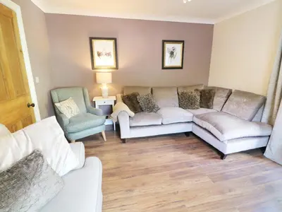 a living room with a couch and two chairs at Shepherd's Crook in Ambleside
