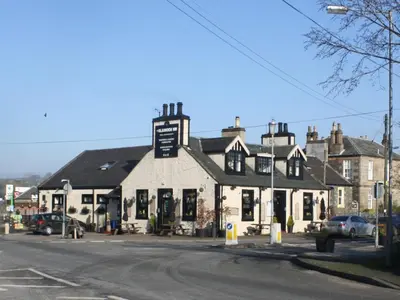 a building on the corner of a street at The Bladnoch Inn in Bladnoch