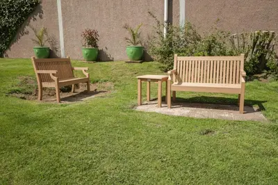 two benches and a table in the grass at Swallows Nest in Carlisle