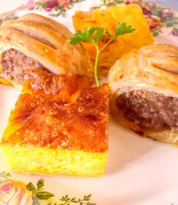a plate with three pieces of food on it at Bessiestown Country Guesthouse in Carlisle
