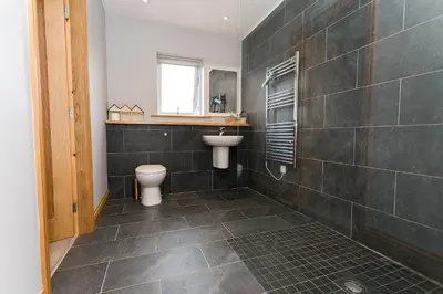 a bathroom with a toilet and a sink at Galloway View in Castle Douglas