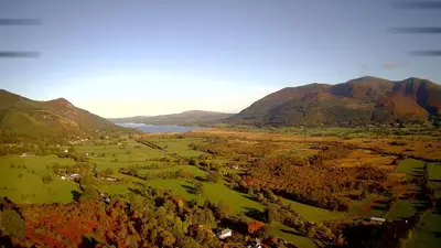 an aerial view of a valley with mountains and a lake at Fern Howe Guest House in Keswick