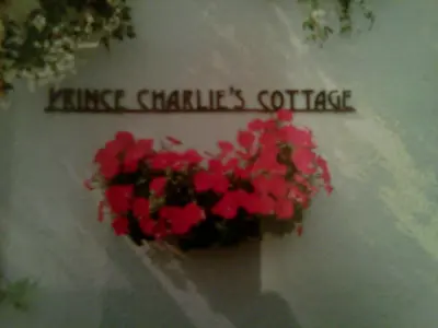 a heart made out of red flowers on a table at Prince Charlie's Cottage in Gretna Green
