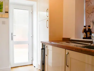 a kitchen with a sink and a counter top at Ghillie Cottage in Cockermouth