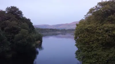 a river with trees on both sides of it at Link House in Bassenthwaite Lake
