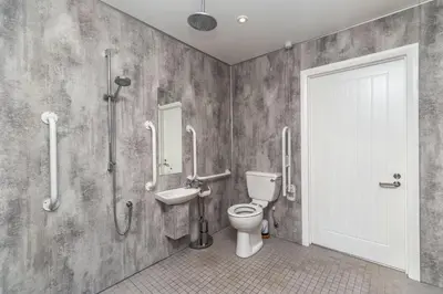 a bathroom with a toilet and a sink at Sam's Cottage in Keswick