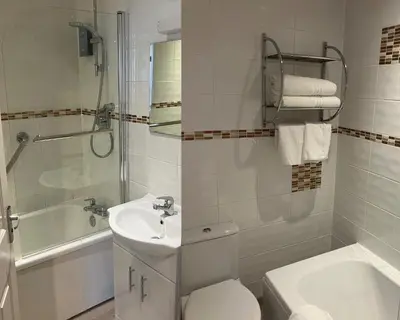 a bathroom with a sink and a toilet and a shower at Welbeck Hotel & Apartments IOM in Douglas