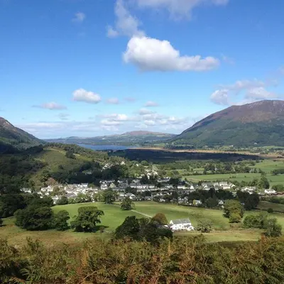 a town in the middle of a valley with mountains at Stanger Cottage in Keswick