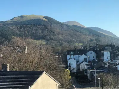 a small town with a mountain in the background at Crow Park Hotel in Keswick