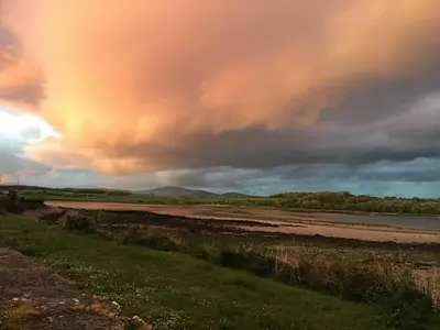 a sunset over a river with a cloudy sky at Cornmill House, With Outstanding Sea Views In Garlieston in Garlieston
