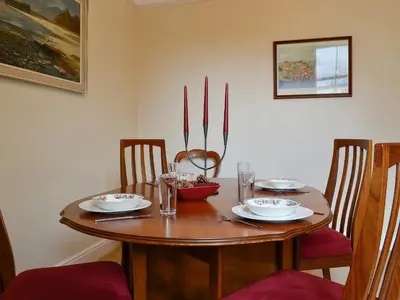 a wooden table with plates and bowls on it at Robinson in Keswick