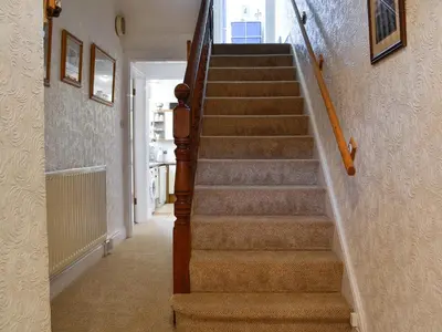 a staircase in a home with a stair case at Robinson in Keswick