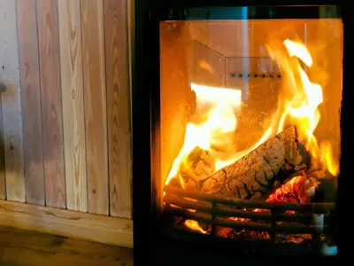 a fire in an oven with some food in it at Little Willow - Uk5998 in Carsluith